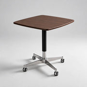 Elevora desk in Walnut finish with wheeled metal base