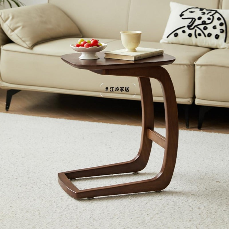 Solid wood C-shaped side table with laptop and cup
